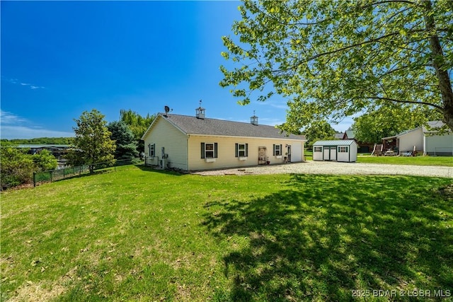 30566 Johnson Bay Dr, Gravois Mills, MO 65037 - back of property featuring a storage unit and an outdoor structure