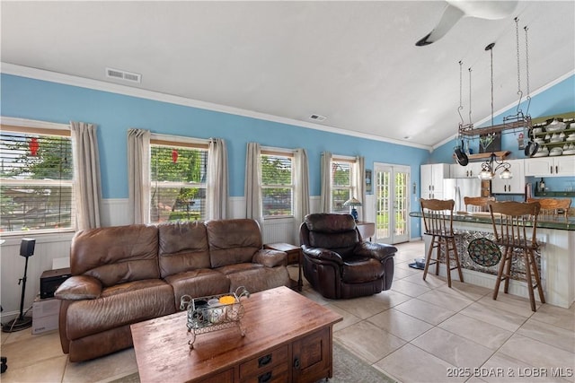 30566 Johnson Bay Dr, Gravois Mills, MO 65037 - living area featuring light tile patterned floors, a ceiling fan, ornamental molding, wainscoting, and plenty of natural light