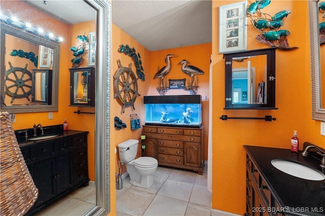 30566 Johnson Bay Dr, Gravois Mills, MO 65037 - full bath featuring toilet, two vanities, and tile patterned floors
