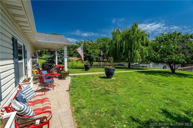 30566 Johnson Bay Dr, Gravois Mills, MO 65037 - view of yard with a patio area and a water view