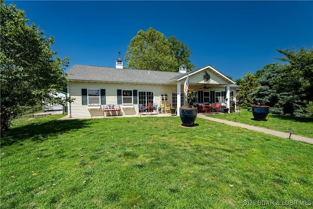 30566 Johnson Bay Dr, Gravois Mills, MO 65037 - rear view of house with ceiling fan, a lawn, a patio, and a chimney