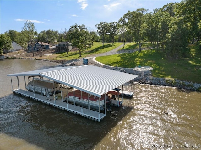 17 Eagles Pass, Climax Springs, MO 65324 - dock area featuring a water view, boat lift, a yard, and view of wooded area