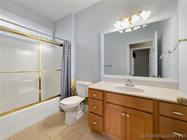 full bathroom with toilet, tile patterned floors, shower / bath combo with shower curtain, and vanity