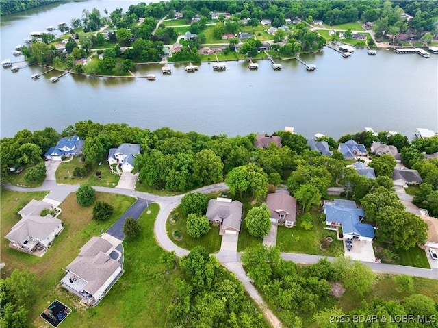 aerial perspective of suburban area featuring a large body of water