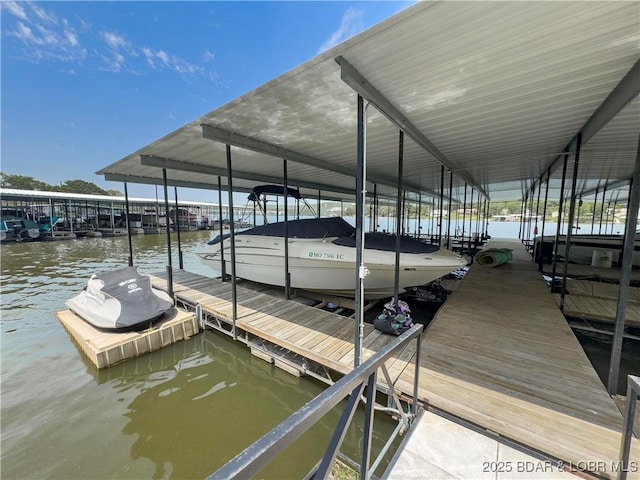 dock area featuring boat lift and a water view