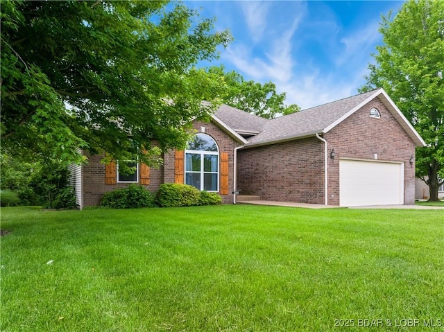 view of front of house with a garage, brick siding, a front yard, and a shingled roof