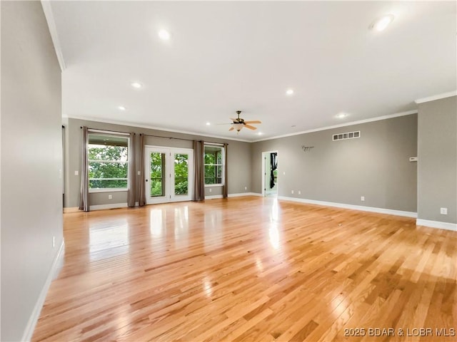 unfurnished room with ornamental molding, light wood-style floors, baseboards, recessed lighting, and a ceiling fan