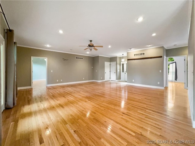 unfurnished living room featuring light wood-style flooring, crown molding, ceiling fan, recessed lighting, and baseboards