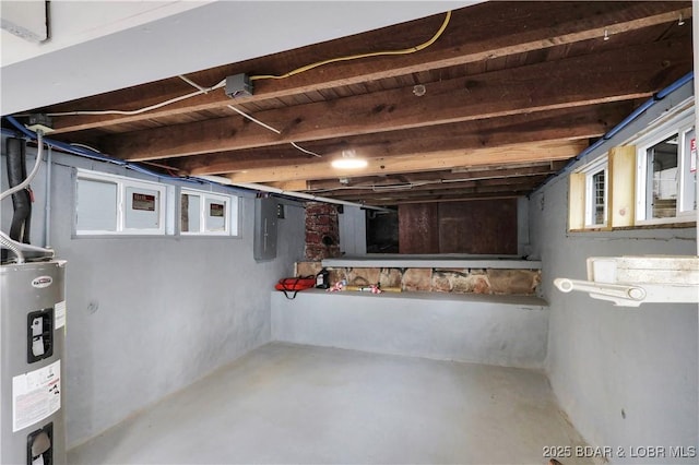 below grade area featuring electric water heater and electric panel