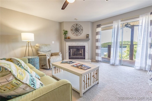 601 Park Place Dr Unit 2B, Kaiser, MO 65047 - living room with ceiling fan, light carpet, and a premium fireplace