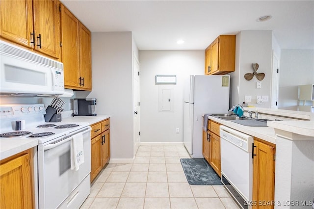601 Park Place Dr Unit 2B, Kaiser, MO 65047 - kitchen with white appliances, light countertops, light tile patterned floors, brown cabinetry, and recessed lighting