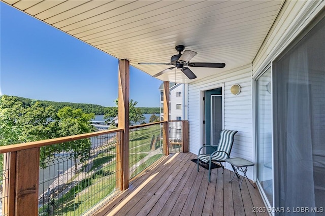 601 Park Place Dr Unit 2B, Kaiser, MO 65047 - deck featuring ceiling fan and a water view