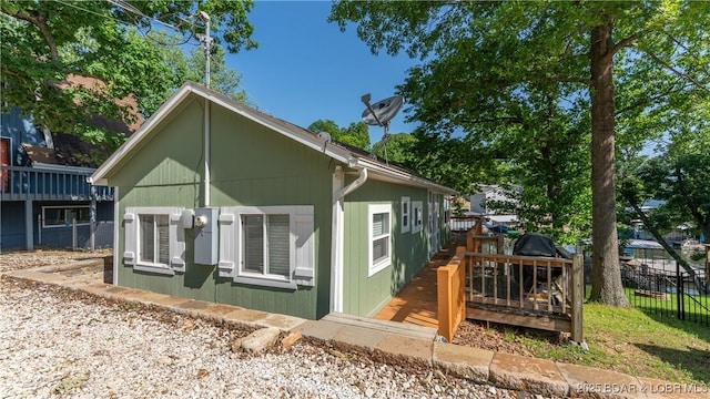 15219 Fleener Dr, Gravois Mills, MO 65037 - view of home's exterior with a wooden deck
