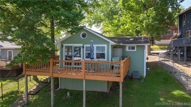 15219 Fleener Dr, Gravois Mills, MO 65037 - rear view of house with a wooden deck and central air condition unit