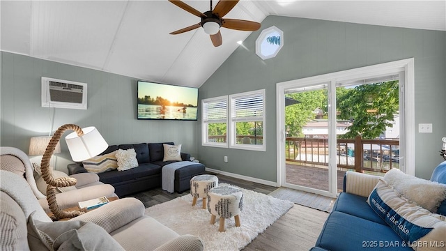 15219 Fleener Dr, Gravois Mills, MO 65037 - living area featuring wood finished floors, ceiling fan, a wall mounted air conditioner, high vaulted ceiling, and baseboards