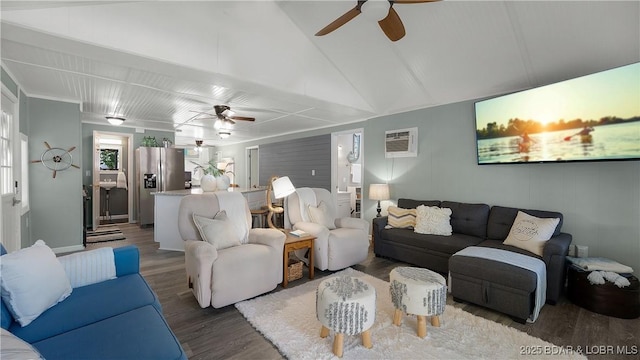 15219 Fleener Dr, Gravois Mills, MO 65037 - living room featuring a ceiling fan, wood finished floors, a wall mounted AC, and vaulted ceiling