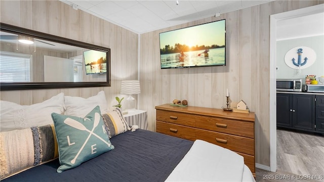15219 Fleener Dr, Gravois Mills, MO 65037 - bedroom featuring light wood-type flooring and ceiling fan