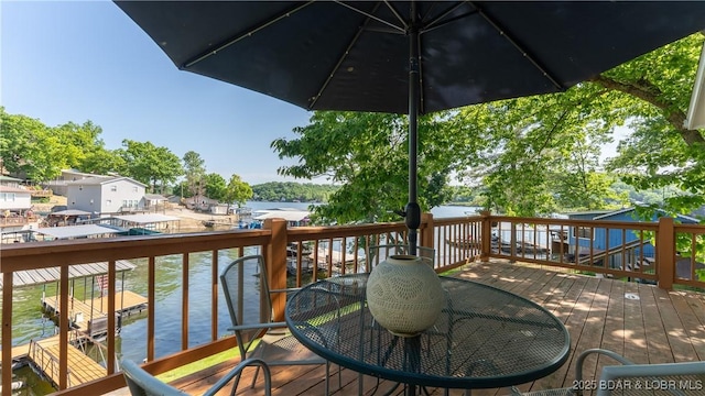 15219 Fleener Dr, Gravois Mills, MO 65037 - wooden terrace featuring a water view and outdoor dining area