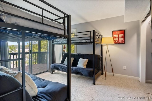 241 Shell Bay Cir Unit 1A, Linn Creek, MO 65052 - carpeted bedroom featuring baseboards and access to outside