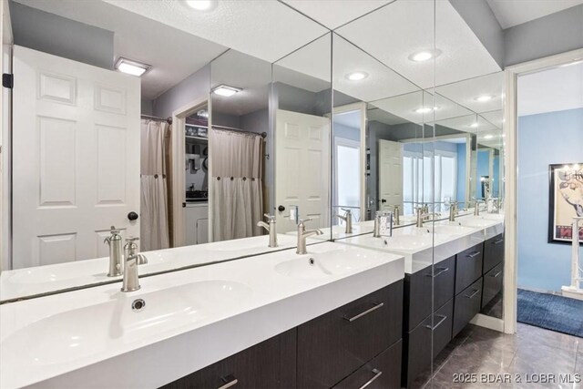 241 Shell Bay Cir Unit 1A, Linn Creek, MO 65052 - bathroom with double vanity, recessed lighting, and marble finish flooring