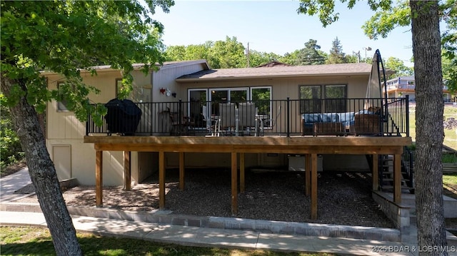 rear view of property with a deck