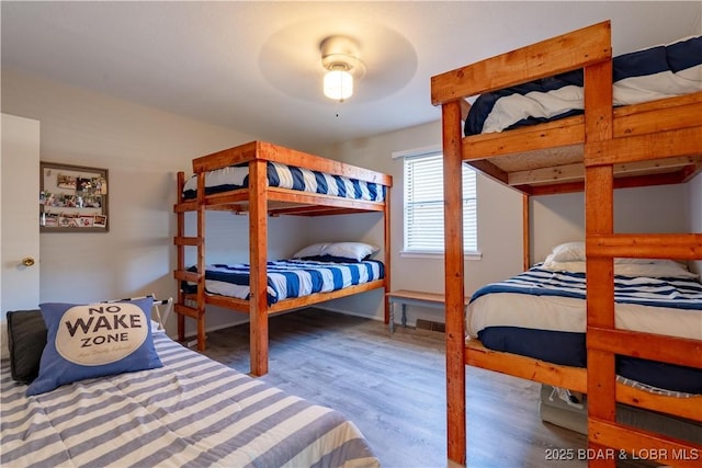 bedroom featuring wood finished floors