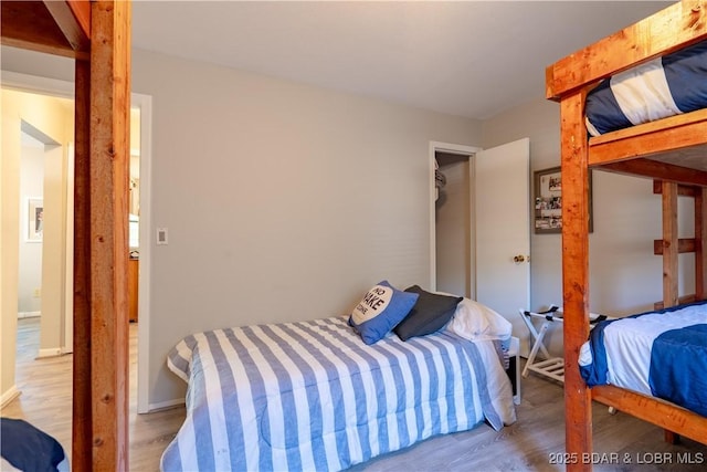 bedroom with wood finished floors