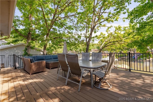 wooden terrace with outdoor lounge area and outdoor dining area