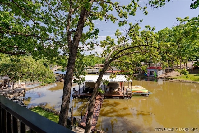 dock area featuring a water view and boat lift
