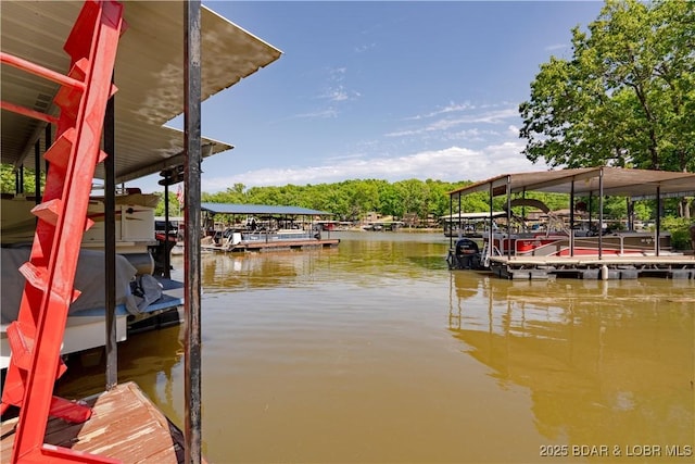 dock area with a water view and boat lift