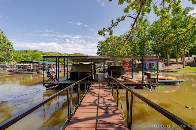 dock area with a water view and boat lift