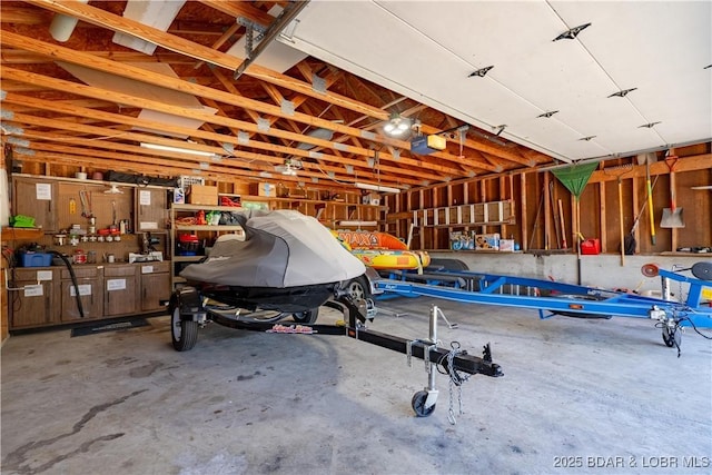garage featuring a workshop area and a garage door opener