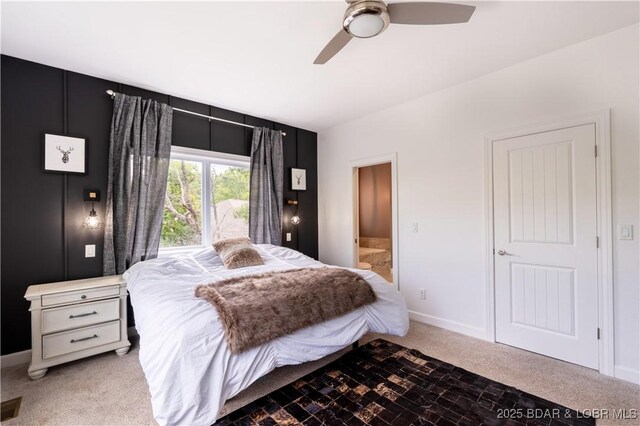 205 Wedge Wood Dr, Camdenton, MO 65020 - bedroom featuring carpet flooring, connected bathroom, a ceiling fan, and baseboards
