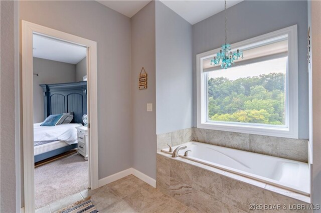 205 Wedge Wood Dr, Camdenton, MO 65020 - bathroom with plenty of natural light, a bath, tile patterned floors, and ensuite bathroom