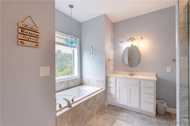 205 Wedge Wood Dr, Camdenton, MO 65020 - full bathroom featuring vanity, a garden tub, a chandelier, and tile patterned flooring