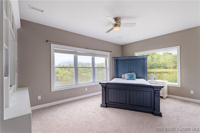 205 Wedge Wood Dr, Camdenton, MO 65020 - bedroom with baseboards, light carpet, and ceiling fan