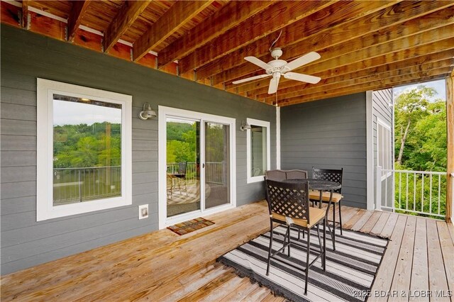 205 Wedge Wood Dr, Camdenton, MO 65020 - wooden terrace featuring ceiling fan and outdoor dining space