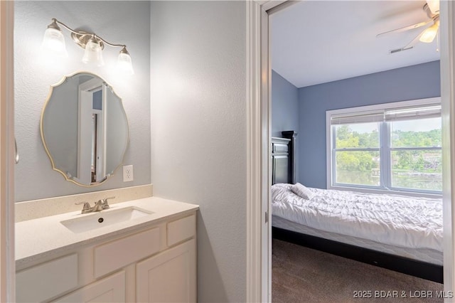 205 Wedge Wood Dr, Camdenton, MO 65020 - ensuite bathroom with vanity and a ceiling fan