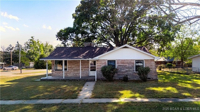 577 Mulberry Ln, Camdenton, MO 65020 - view of front facade with stone siding, covered porch, and a chimney