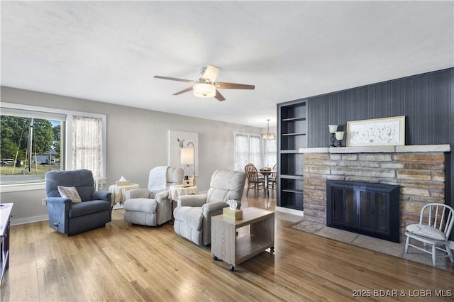 577 Mulberry Ln, Camdenton, MO 65020 - living area featuring plenty of natural light, ceiling fan, wood finished floors, and a fireplace