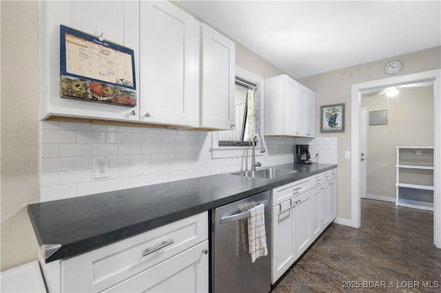 577 Mulberry Ln, Camdenton, MO 65020 - kitchen featuring a sink, stainless steel dishwasher, dark countertops, and white cabinets