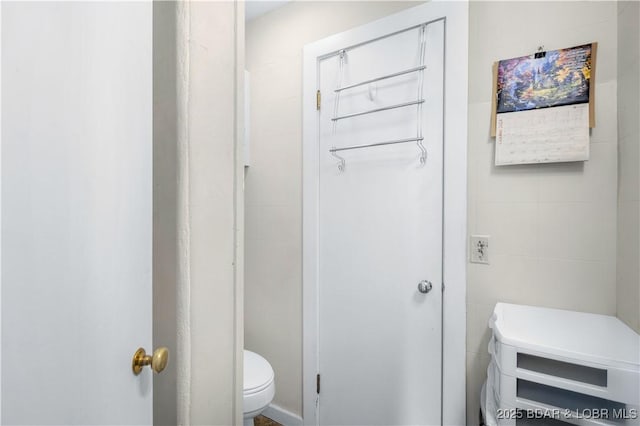 577 Mulberry Ln, Camdenton, MO 65020 - bathroom with toilet and tile walls
