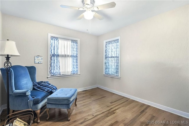 577 Mulberry Ln, Camdenton, MO 65020 - living area with wood finished floors, baseboards, and a ceiling fan