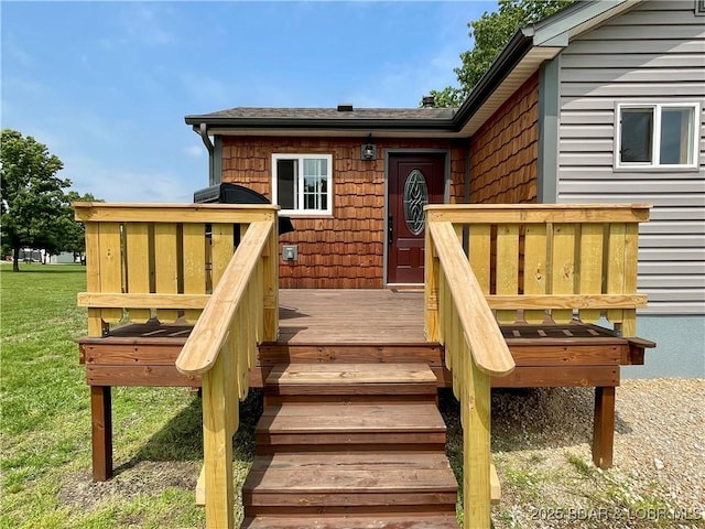 deck featuring a lawn