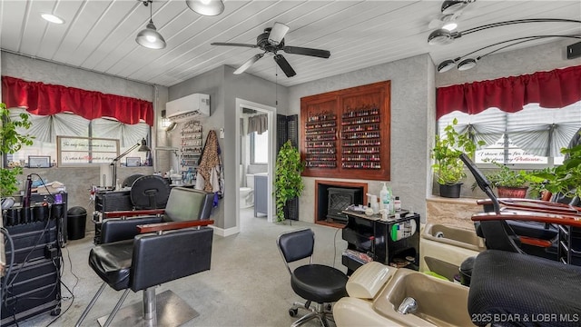 312 Charger Dr, Macks Creek, MO 65786 - living room with a wall unit AC, finished concrete floors, and ceiling fan