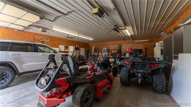 312 Charger Dr, Macks Creek, MO 65786 - garage featuring a garage door opener