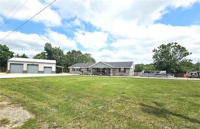 312 Charger Dr, Macks Creek, MO 65786 - view of front of house featuring a garage, an outdoor structure, and stone siding