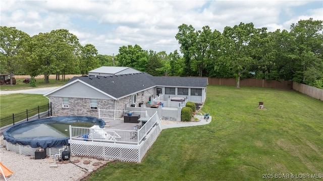 312 Charger Dr, Macks Creek, MO 65786 - back of house featuring an outdoor living space, a sunroom, a deck, and stone siding