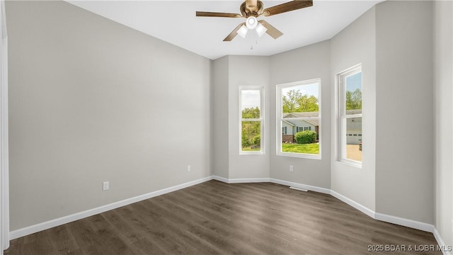 103 Primrose Ln, Camdenton, MO 65020 - empty room with baseboards, dark wood-type flooring, and ceiling fan