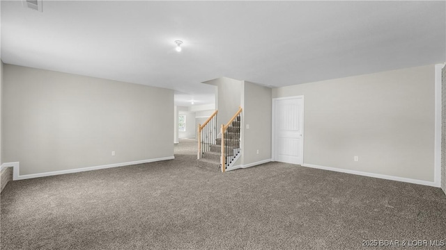 103 Primrose Ln, Camdenton, MO 65020 - unfurnished living room with carpet flooring, stairway, and baseboards